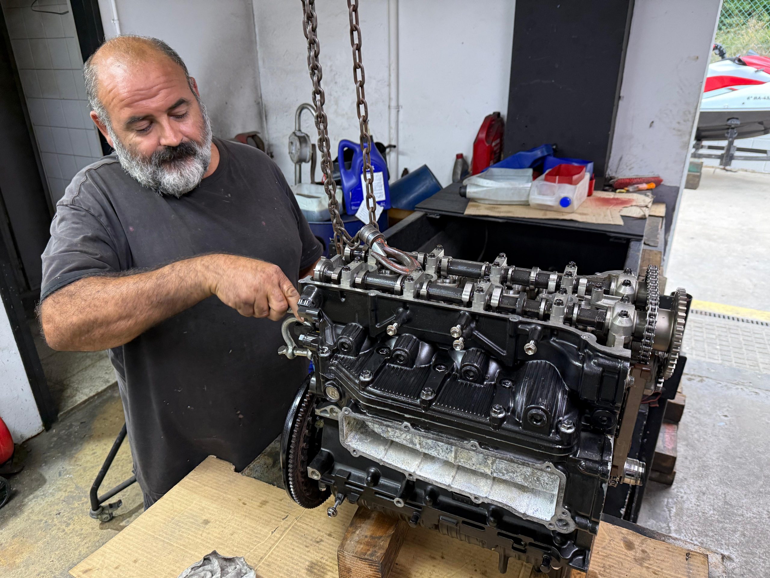 man working on engine